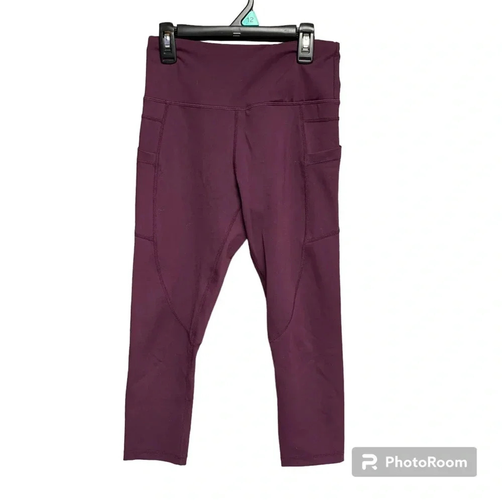 Zyia active leggings size 4 plum color. Side pockets and small one inside waist